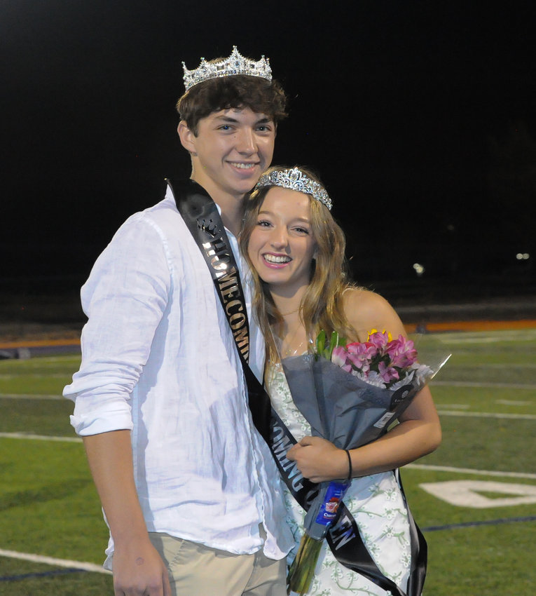Holy Family seniors Colton Pedro and Julia Hoffman pose for pictures after they were crowned homecoming king and queen Sept. 30 in Broomfield.